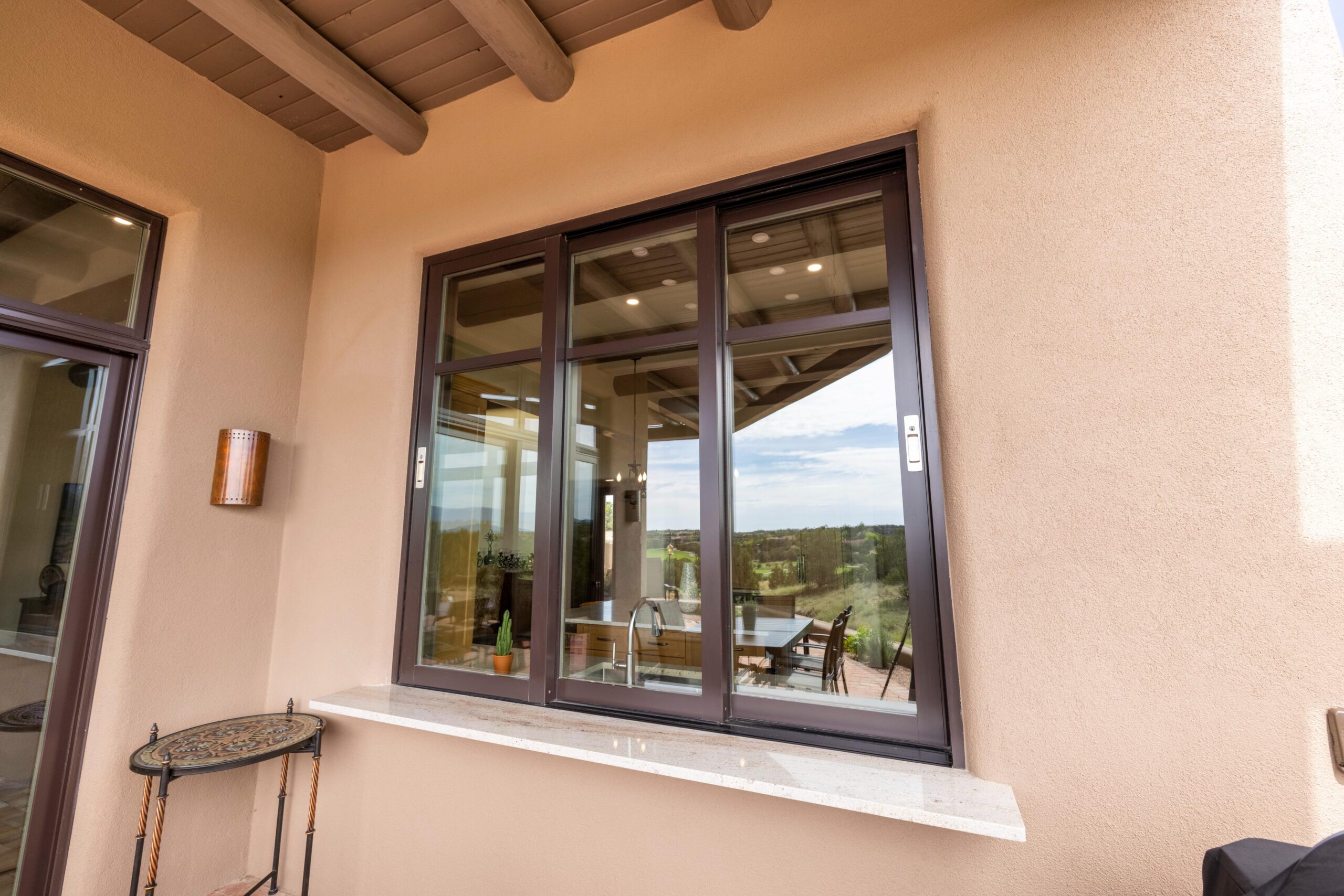 Glass sliding door with outdoor view.