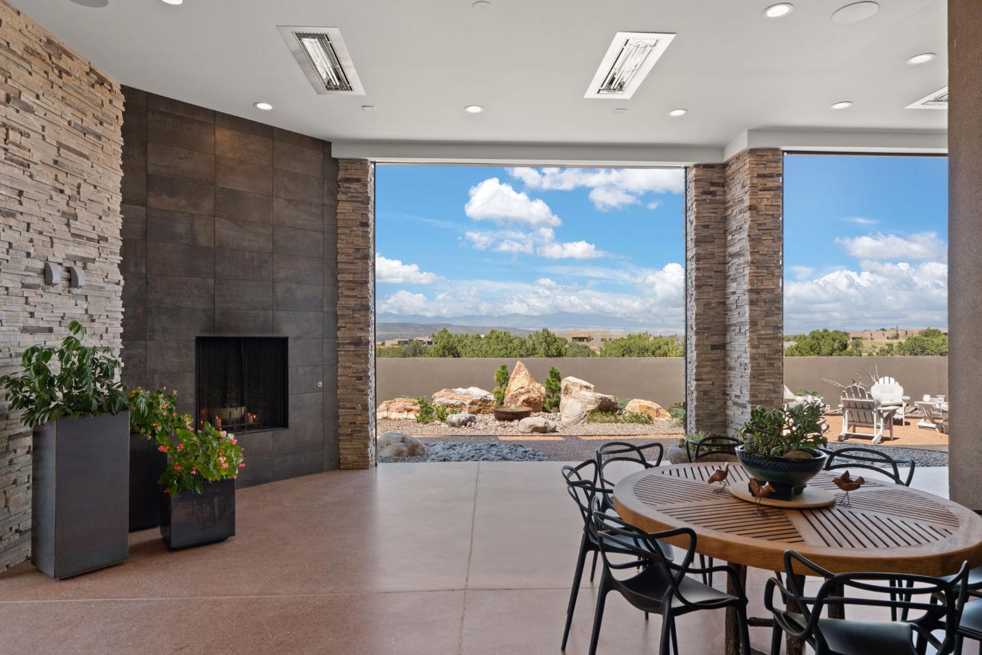 Modern open living space with a large window showcasing a scenic outdoor view.
